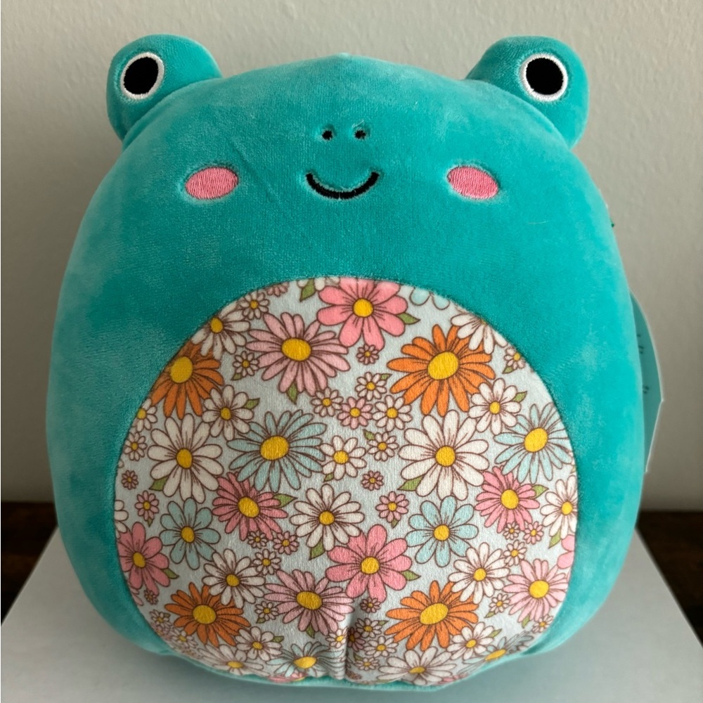 Squishmallow - Robert TheTeal Frog Plush with a Floral Belly.